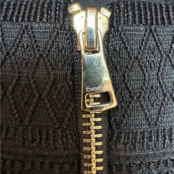 Bebe mini skirt fit and flare black with corset detail on top. Size 2 - Picture 5 of 5